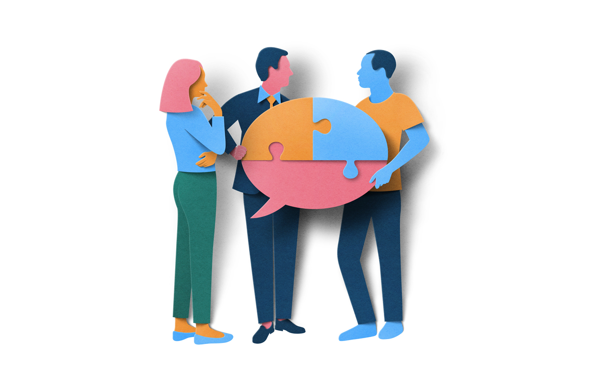 People peicing together jigsaw