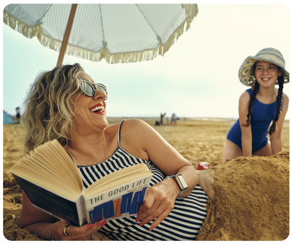 Image of a woman and child at the beach