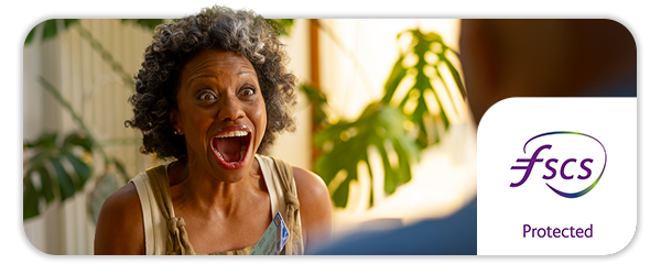 Close up image of a woman with a happy shocked face